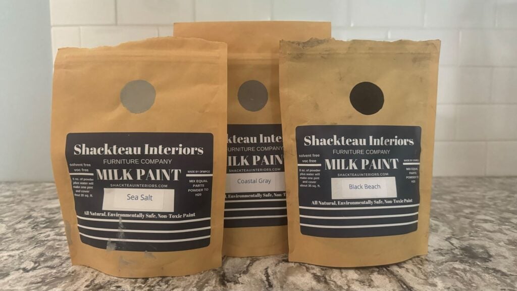 PHoto of three pouches of the powder form milk paint by Shackteau Interiors.