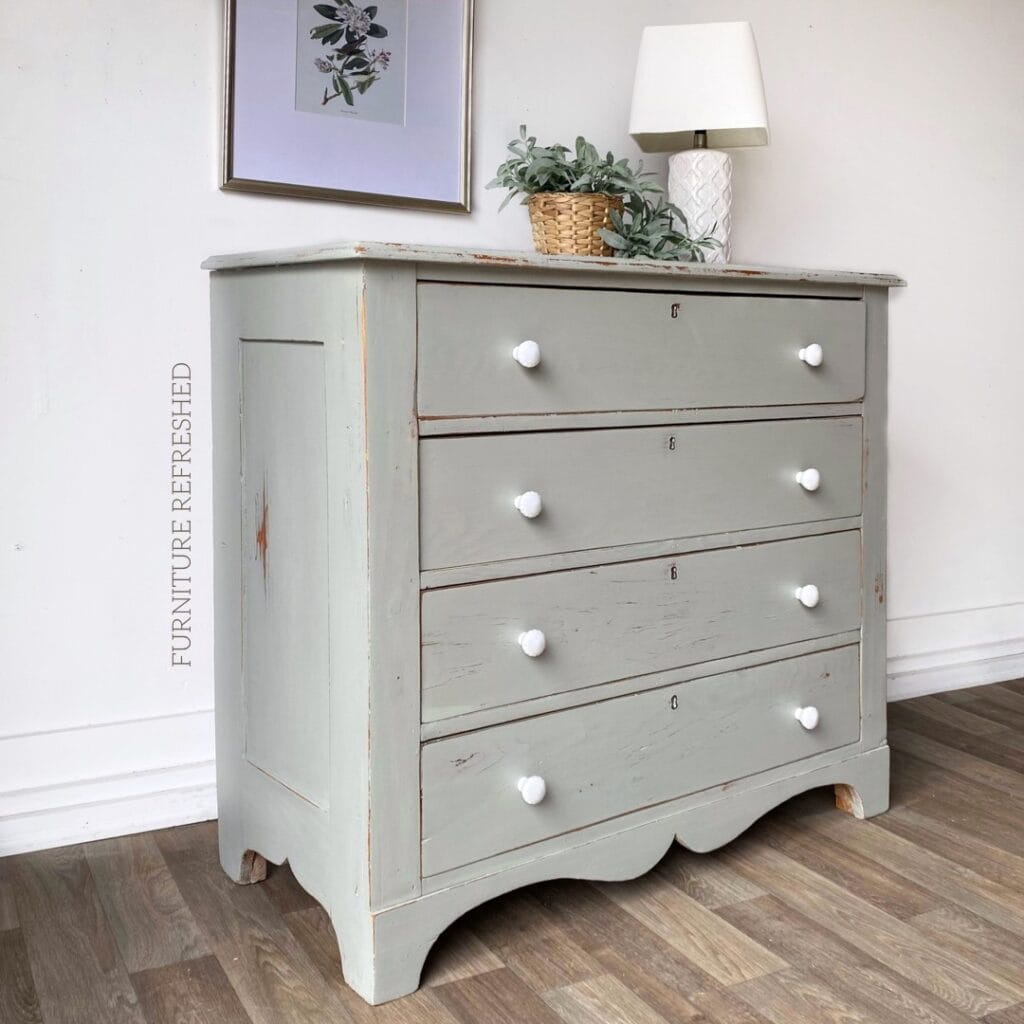 Antique pine dresser with light blue chippy paint finish.