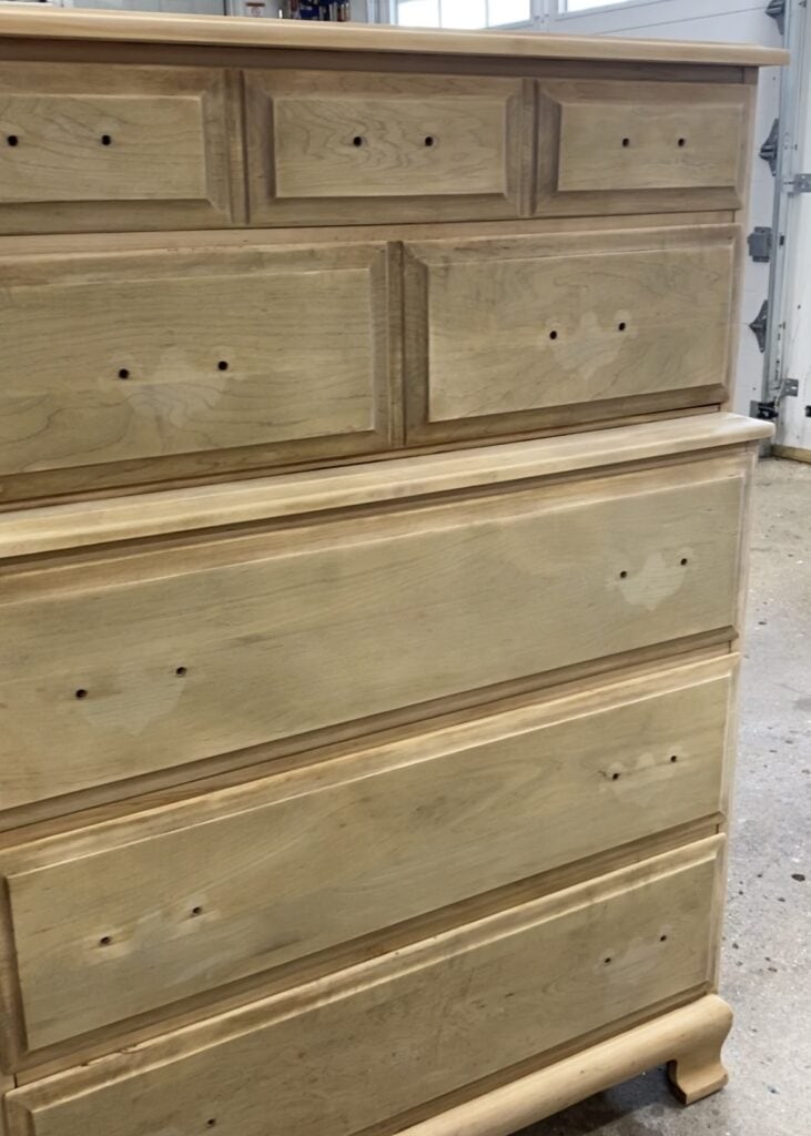 A vintage dresser that has been stripped of existing finish, cleaned and sanded.