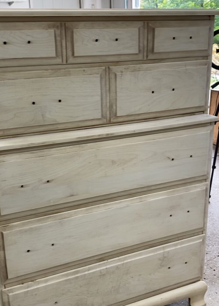 A photo of the same vintage dresser after using the Zinsser wood bleaching kit.