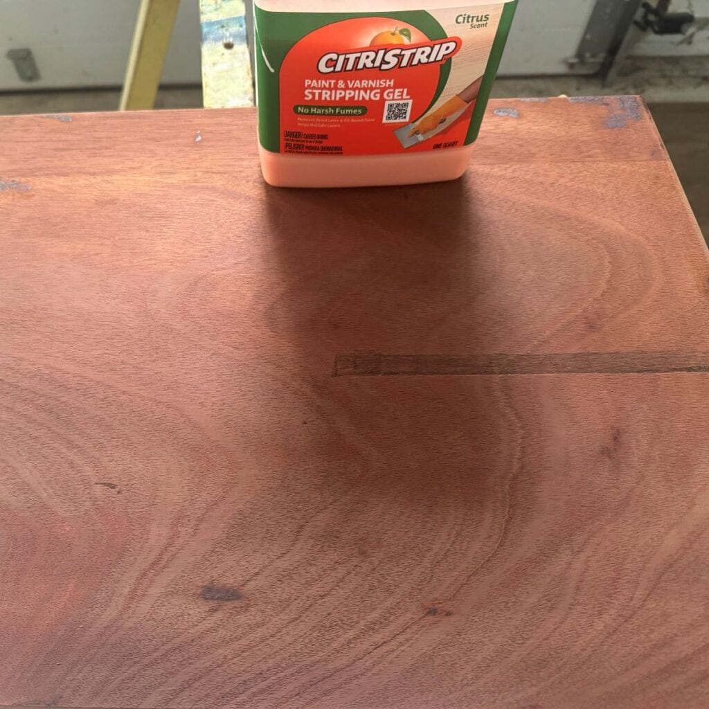 photo of the table top after being stripped with Citristrip and cleaned. Most of the existing finish has been removed.