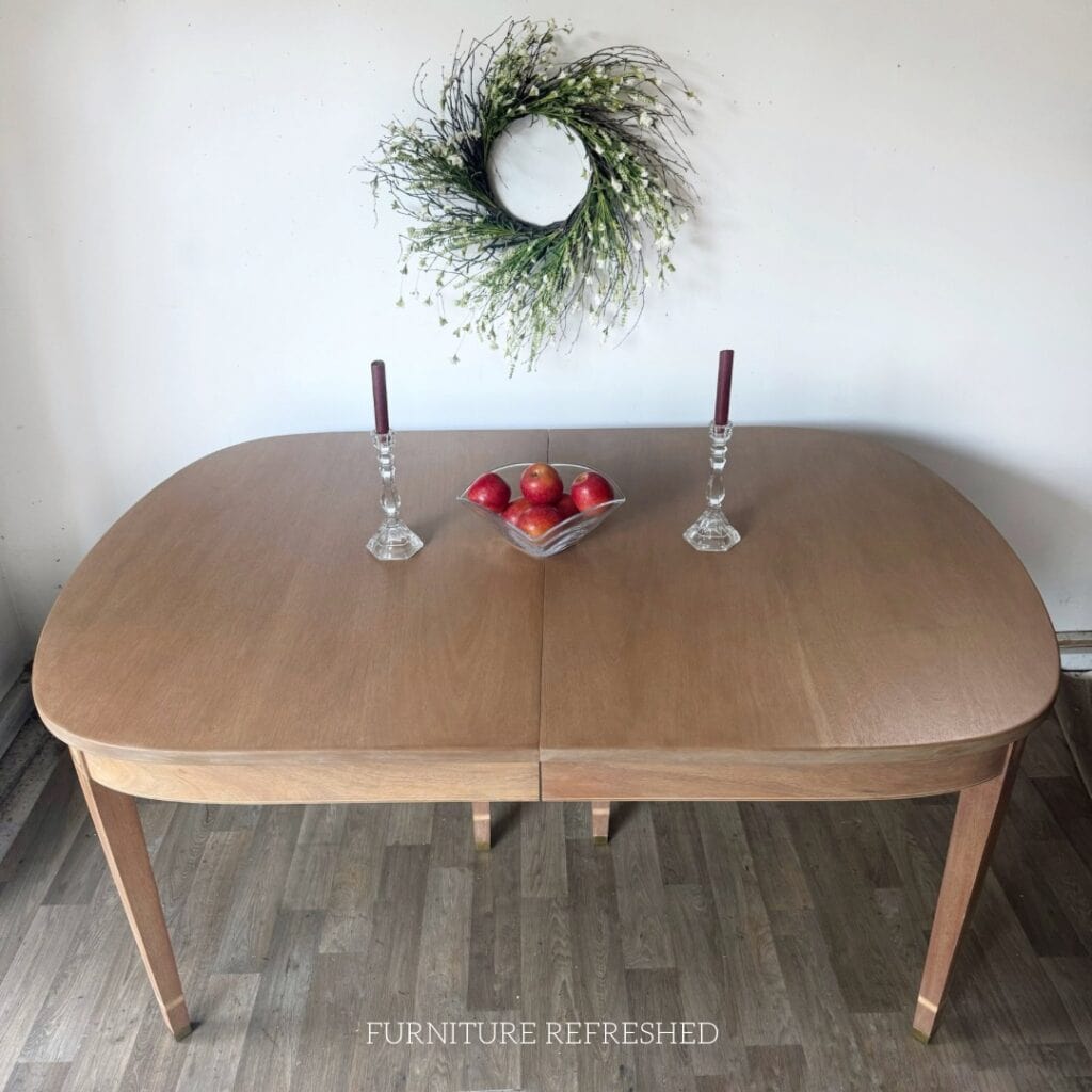 Dining table with it's new light wood finish. Viewed from the top.