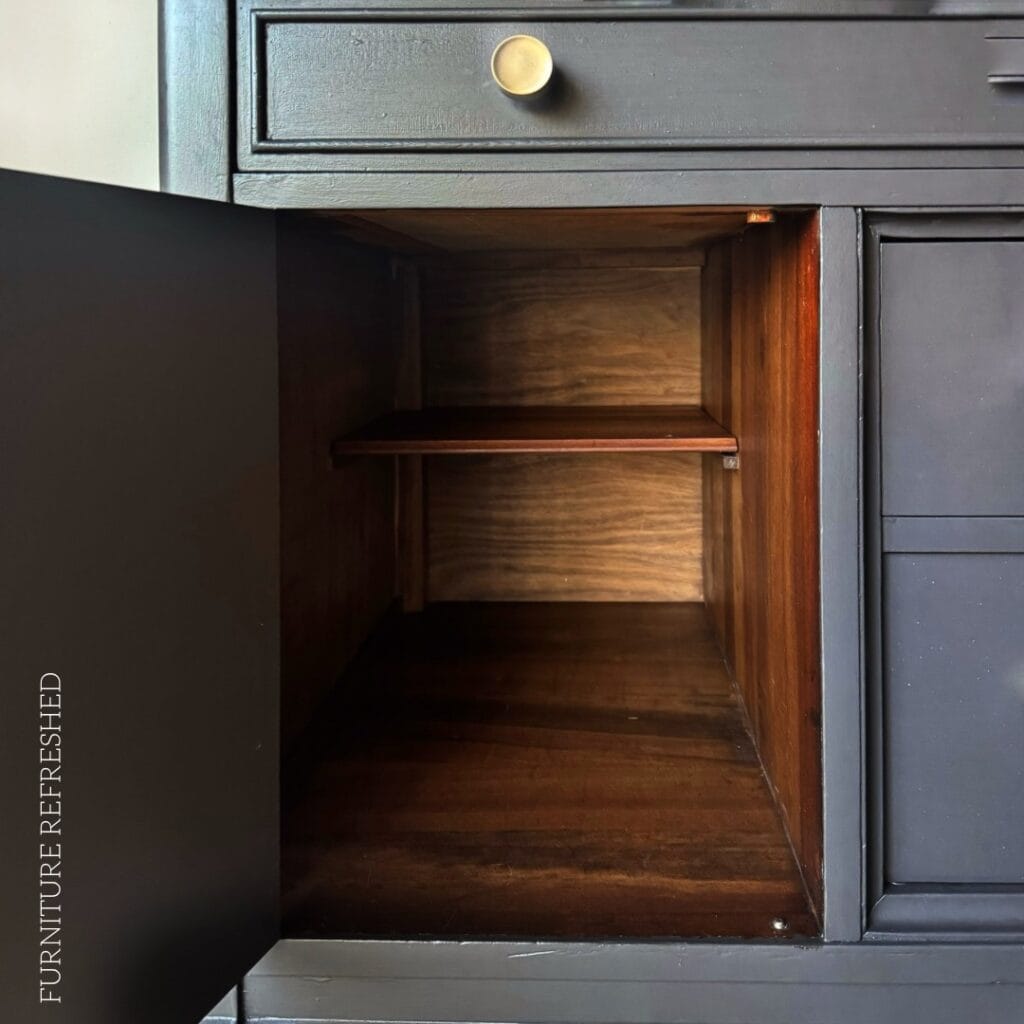 Close up of the restored wood inside of the buffet cabient