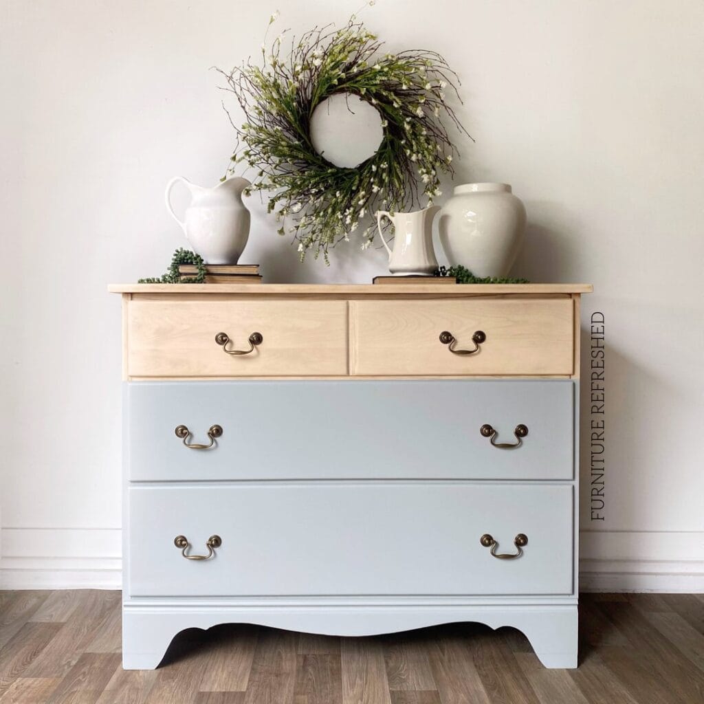 After photo of dipped dresser makeover with raw wood top and light blue painted bottom.