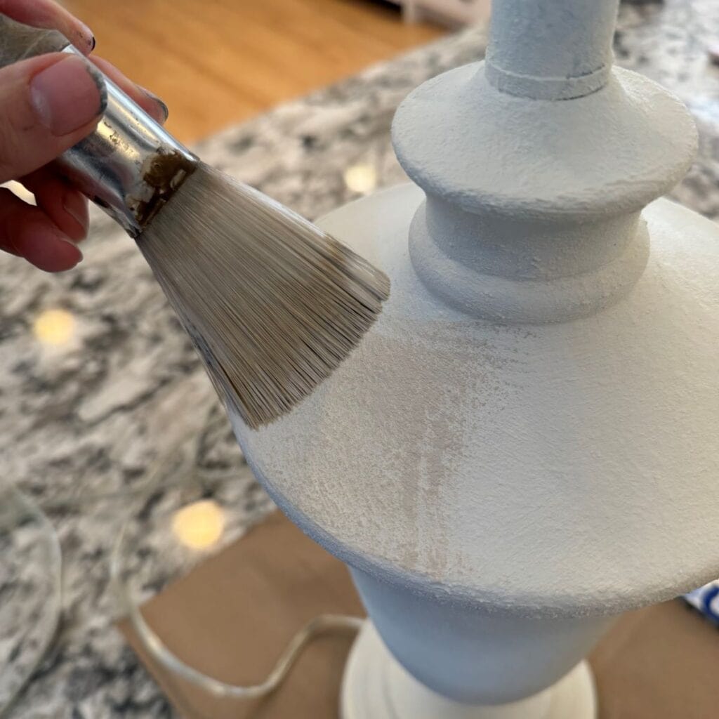 Dry brushing the accent color onto the lamp.