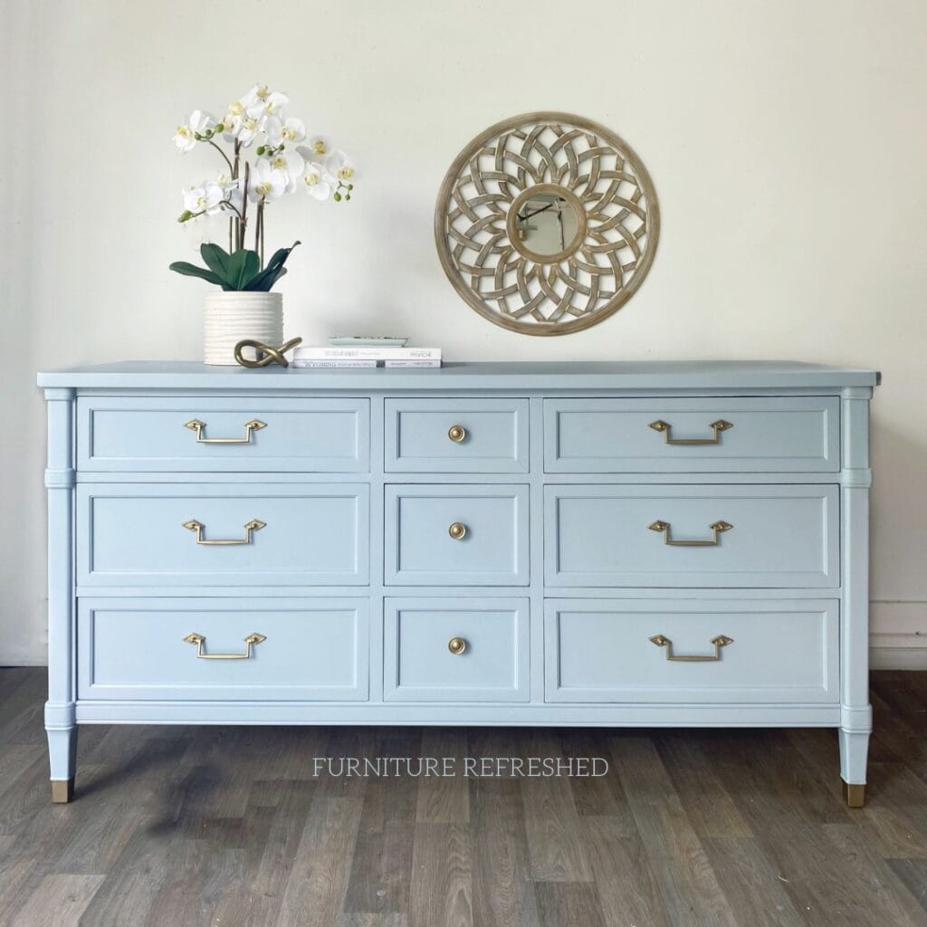 After photo of a nine drawer dresser painted in light blue.