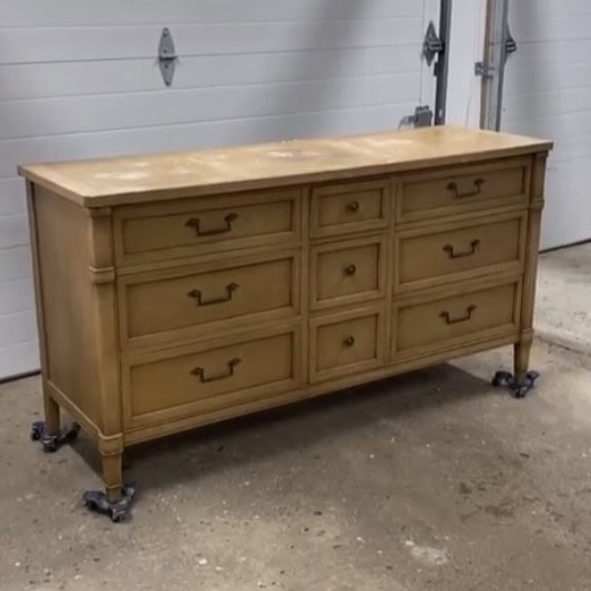 Before photo of nine drawer dresser with a light blonde wood finish.