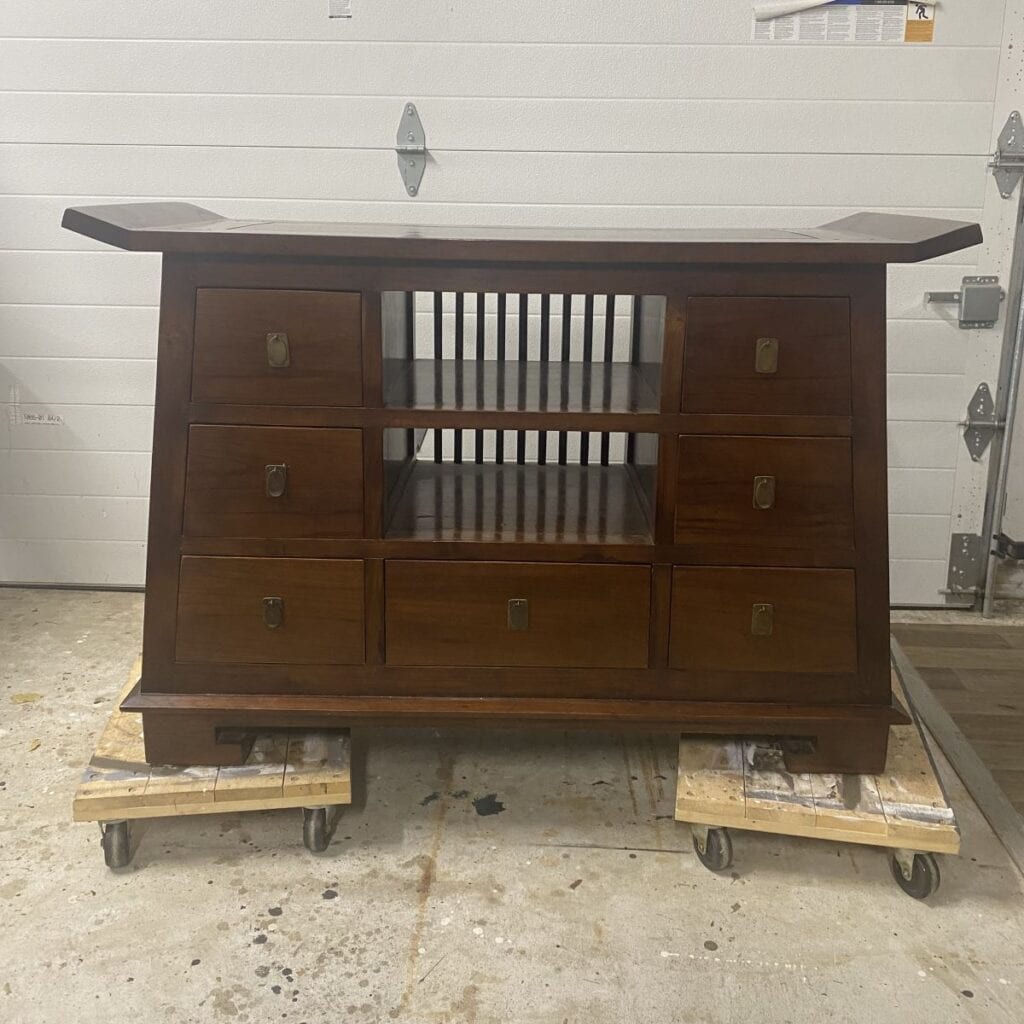 Before photo of Chinoiserie style sideboard in dark brown stained finish. 