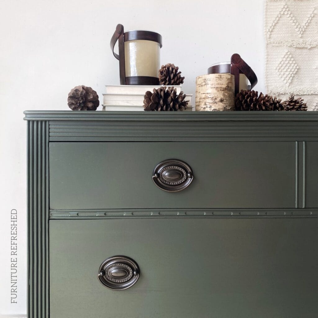 Close up of the top corner of the dresser highlighting the Hepplewhite hardware